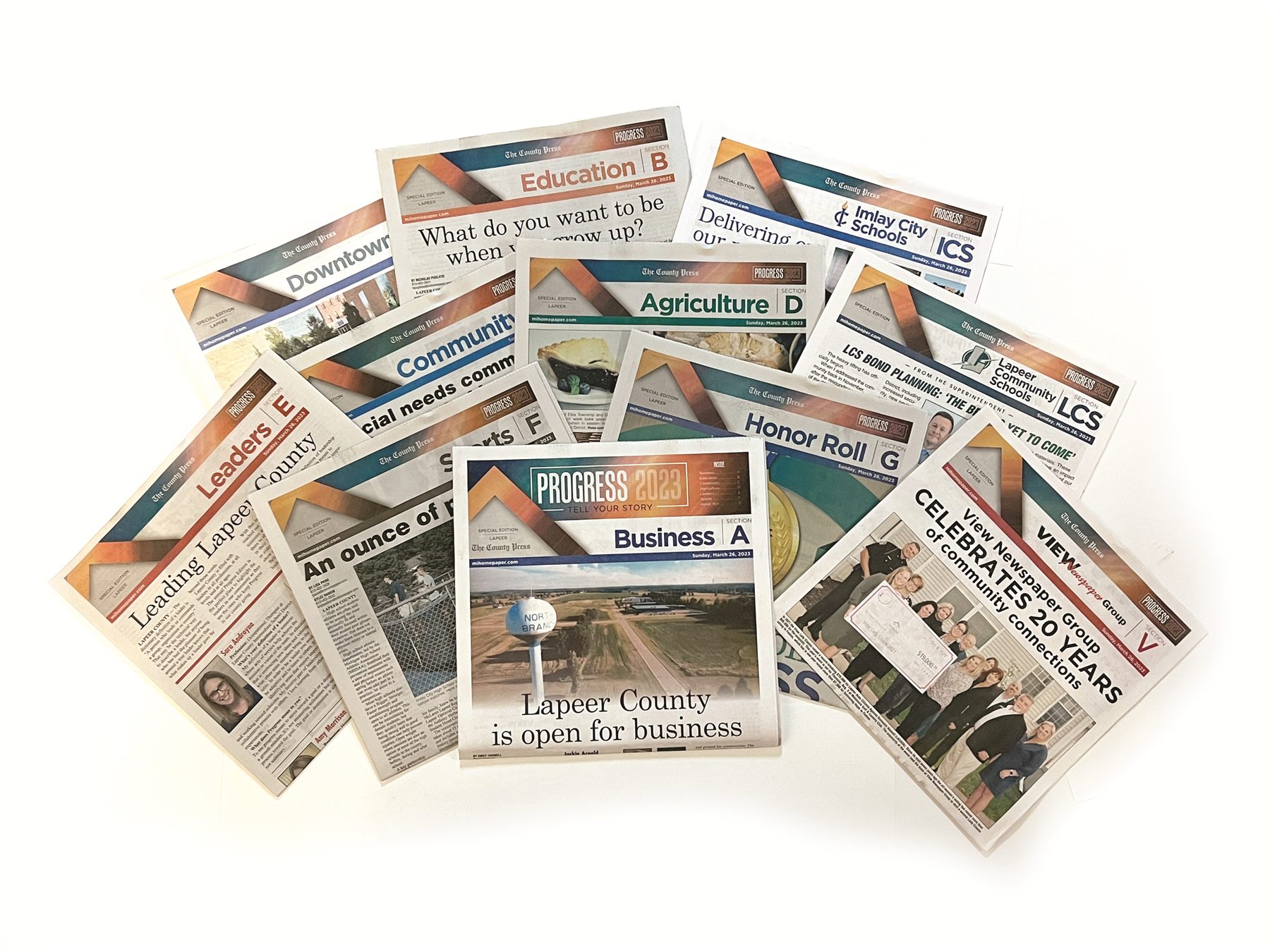 A selection of full-color newspaper sections printed in Michigan